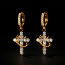 Luxury earrings with a crown and cross design, set with precious stones